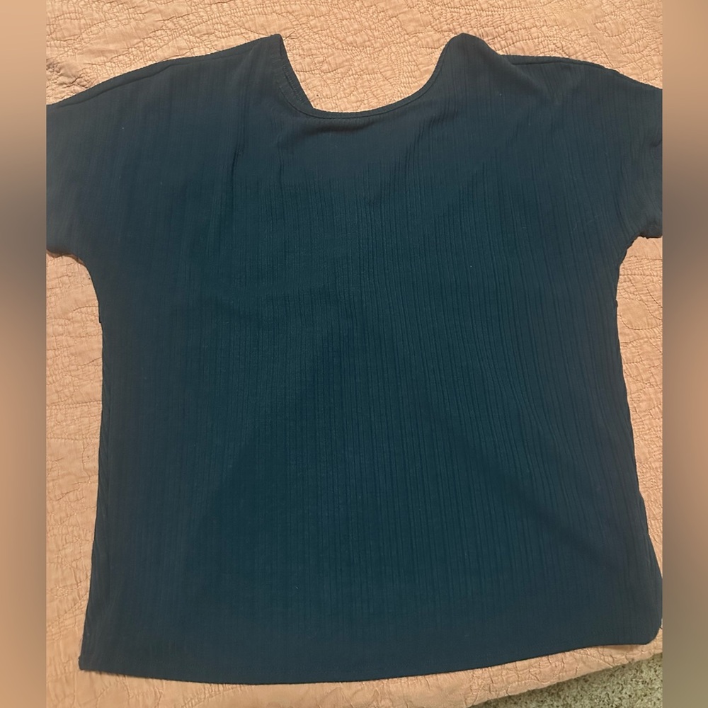 Navy blue ribbed knit top with a twist detail on the back